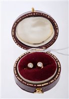 Lot 419 - Pair of diamond stud earrings, each with a...