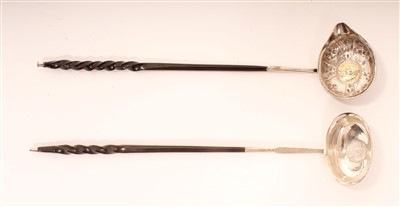 Lot 422 - Georgian silver toddy ladles with ornate floral decoration and another with plain oval bowl