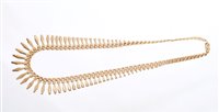 Lot 516 - Etruscan Revival 9ct gold fringe necklace,...