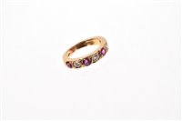 Lot 518 - Ruby and diamond half eternity ring with four...