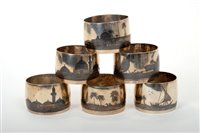 Lot 202 - Set of six Middle-Eastern white metal napkin...