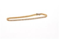 Lot 526 - 18ct gold diamond tennis bracelet with 65...