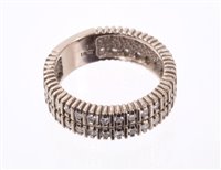 Lot 530 - Diamond double row eternity ring with single...