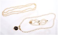 Lot 535 - Cultured pearl opera length necklace with a...