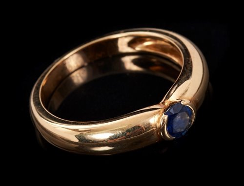 Lot 442 - Cartier 18ct gold and sapphire ring with a...