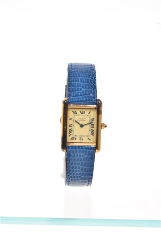 Lot 634 - Ladies' Must de Cartier gold plated tank...