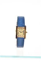 Lot 634 - Ladies' Must de Cartier gold plated tank...