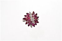 Lot 515 - Diamond and ruby cocktail ring of stylised...