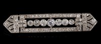 Lot 474 - Art Deco diamond plaque brooch, the openwork...