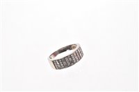 Lot 484 - 18ct white gold and diamond ring with a wide...