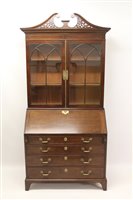 Lot 1249 - George III mahogany bureau bookcase, the upper...