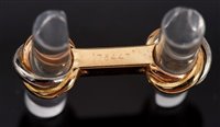 Lot 460 - Pair of Cartier 'Trinity' 18ct gold and rock...