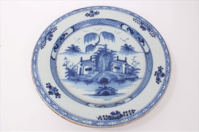Lot 293 - Mid-18th century Lambeth Delft blue and white charger with Chinese landscape decoration, 34.5cm