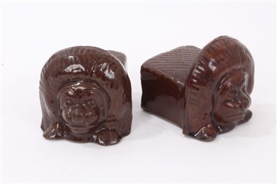 Lot 1036 - Pair of 19th century treacle glazed ceramic sash window rests