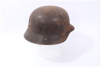 Lot 631 - Second World War Waffen SS Helmet with Battle Damage