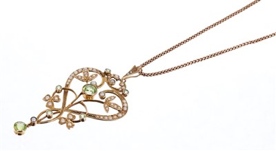 Lot 583 - Victorian peridot and seed pearl open work scroll pendant on rose gold chain
