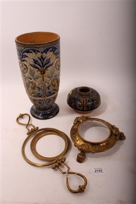 Lot 2155 - Doulton Lambeth stoneware lamp base by Louisa E. Edwards,
with foliage decoration on blue and buff ground, standing on brass base with
hoof feet