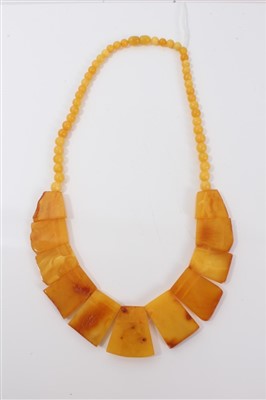 Lot 3206 - Art Deco amber panel and bead necklace