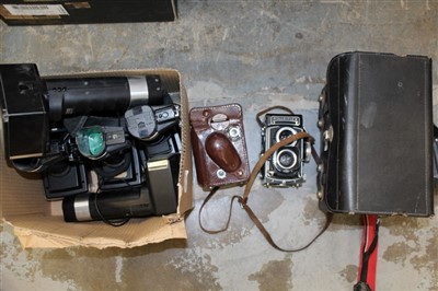 Lot 3794 - Two vintage Rolleiflex TLR cameras, one a 3.5F with Zeiss
Planar lens and case, the other a 3.5T with Zeiss Tessar lens, together with
five Metz flashguns and a Polaroid Passport camera