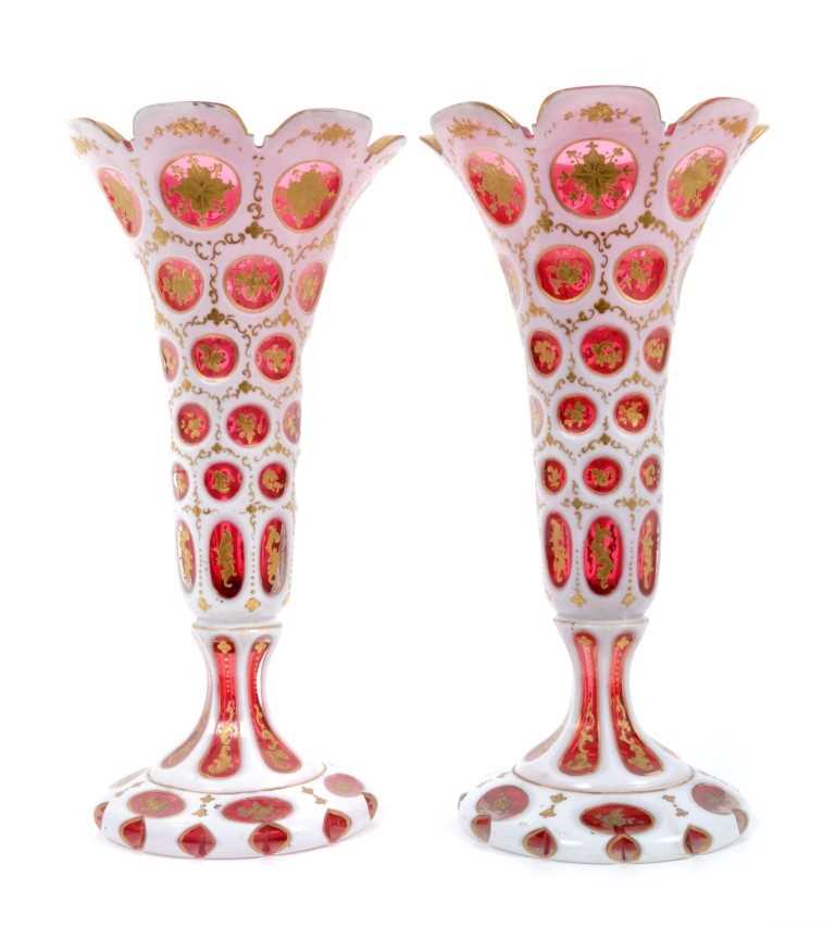 Lot 253 - Pair of mid-19th century Bohemian ruby and white overlaid glass vases, splayed foot, 27.5cm