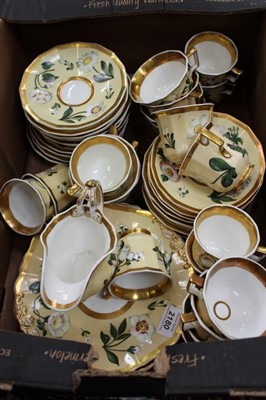 Lot 2180 - Porcelain tea and coffee service with gilt rim and floral
decoration on yellow ground (43 pieces)
