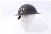 Lot 595 - Second World War British Military MKII Steel Helmet with black painted finish and white lettering- F.A.P. 3. (First Aid Party?)
