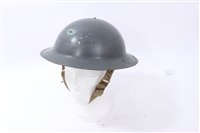 Lot 597 - econd World War British Military MKII Steel Helmet with painted finish and badge for - Symblem Battery Factory, South Mimms