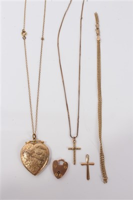 Lot 3234 - Group gold (9ct) jewellery including two cross pendants, chain, bracelet, padlock claps and a heart shaped locket on yellow metal chain