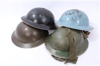 Lot 601 - Group of four Second World War British Military MKII Steel Helmets to include Home Front / Civil Defence and Camouflaged Helmet dated 1939 (4)