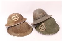 Lot 602 - Two Second World War British Military MKII Steel Helmets together with a 1941 A.R.P Helmet a British MKIV Steel helmet with Royal Green Jackets Badge (4)