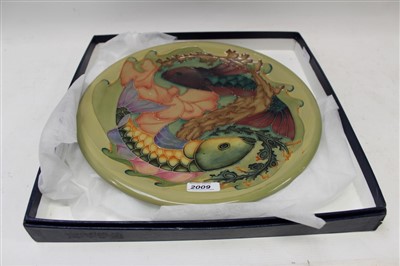 Lot 2009 - Moorcroft Coy Carp pattern charger with tube-lined decoration on green ground – monogram and impressed marks, 35cm diameter, boxed