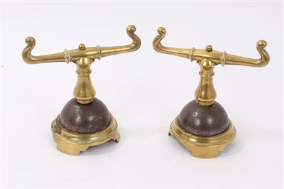 Lot 869 - Pair of Victorian brass fire dogs in the manner of Christopher Dresser