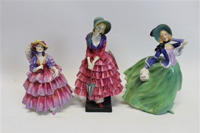Lot 2079 - Three Royal Doulton figures – The Hinged Parasol HN1578, Priscilla HN1340 and Autumn Breezes HN1913
