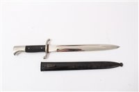 Lot 821 - Second World War Nazi Fire brigade dress Bayonet with black checkered plastic grip and polished steel blade (retaining almost all original finish) by Puma, Solingen. In black painted steel scabbard.
