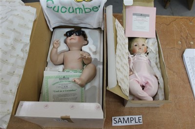 Lot 2828 - Dolls – Ashton Drake selection – Pretty as a Picture, Lullaby Baby, Hannah needs a hug, Sugar Plum, A bit of Sunshine, Cool as a Cucumber, Pumpkin, Tickles, Peanut, all boxed (9)