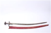 Lot 837 - 19th century Indian tulwar with silver damascened disc hilt, curved blade in red velvet-covered scabbard