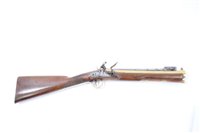 Lot 900 - Early 19th century flintlock blunderbuss by Savage & March, with brass flared barrel, Birmingham Proofs spring bayonet, side lock with roller friezen and safety catch, walnut stock with brass furni...