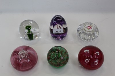 Lot 2142 - Seven various glass paperweights – including Caithness ring stand, three Teign Valley, one Royal Brierley, one Isle of Man and one crystal with inset porcelain plaque