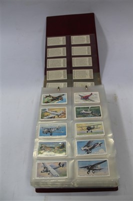 Lot 2493 - Cigarette cards - selection in album and loose - including Ardath Britains Defenders, Wills Merchant Ships of the World, plus other trade and reproduction issues, postcards - including Nostalgia, etc