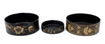 Lot 809 - Three Regency black papier mache wine coasters