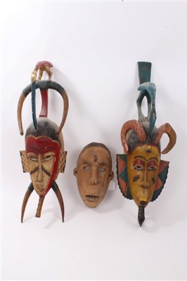 Lot 874 - Three tribal masks, Sudan and others