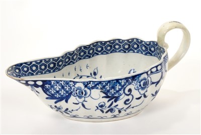 Lot 186 - 18th century Worcester blue and white ‘full moon’ pattern sauce boat and ‘floral spray’ pattern dish