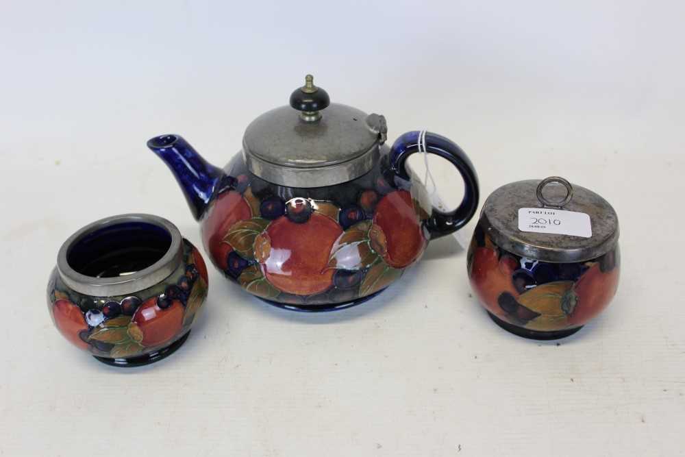 Lot 2010 - Moorcroft pomegranate teapot and two bowls
