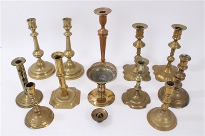 Lot 850 - Pair of early 18th century brass candlesticks