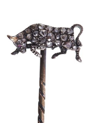 Lot 554 - Antique diamond novelty stick pin in the form of a charging bull / Taurus, with ruby eye and pavé set rose cut diamonds, gold horns in silver and gold setting