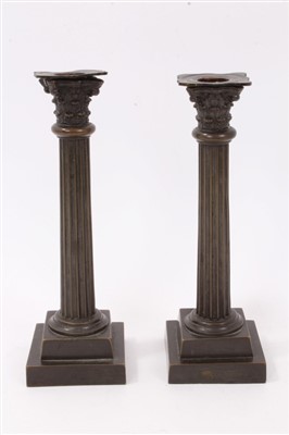 Lot 621 - Pair of 19th century bronze Corinthian column candlesticks