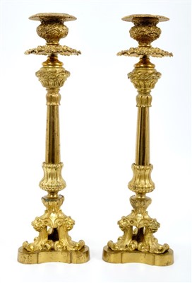 Lot 620 - Pair of early 19th century ormolu candlesticks