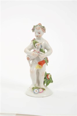 Lot 189 - 18th century Bow porcelain putti holding a dog, circa 1760, 11.5cm