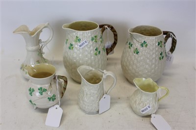 Lot 2001 - Group of six Belleek porcelain jugs