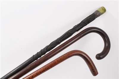 Lot 635 - Unusual Irish carved bog oak walking stick, 19th century patridgwood cane and another cane